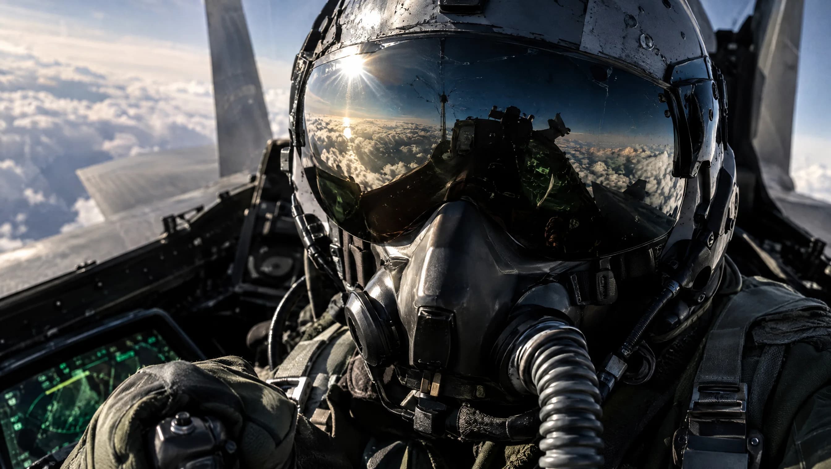 A fighter pilot in helmet and oxygen mask above the clouds, the sky reflected in the visor.